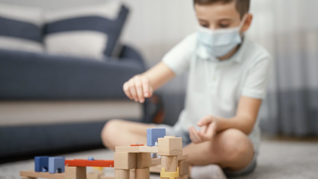 stay indoors kid playing with toys scaled